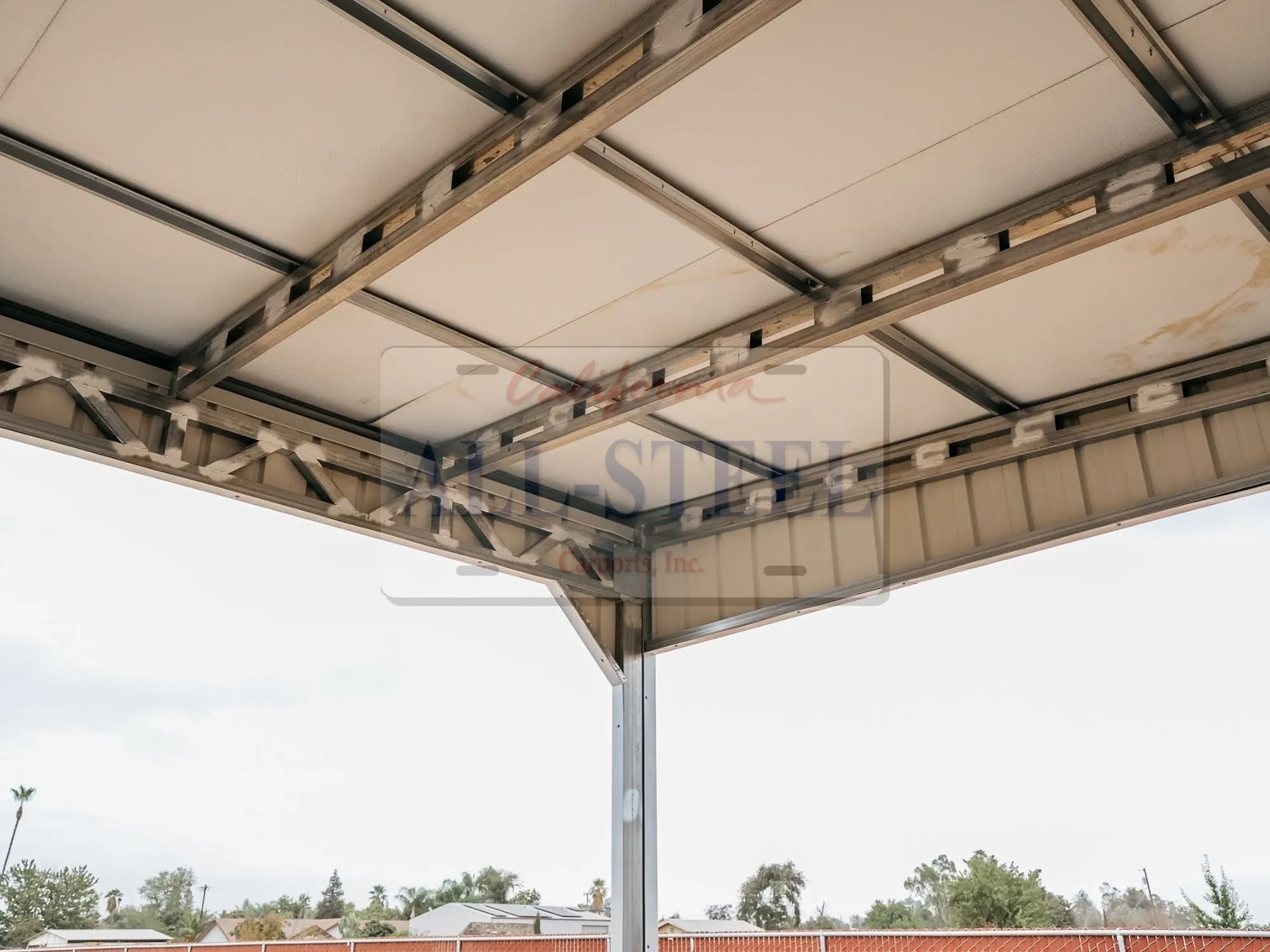 Metal roof panels built to resist wind and hail damage
